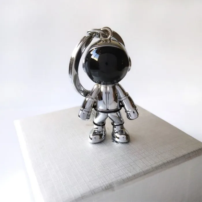 Modieuze handgemaakte sleutelhanger - met 3D astronaut - ruimterobotSleutelhangers