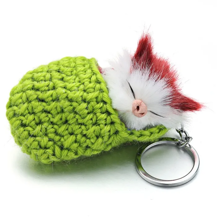 Slapende kat in een handgeweven ledikant - sleutelhangerSleutelhangers