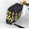 Kleine clutch - drievoudige ritssluiting - polsbandje - stippenpatroonTassen