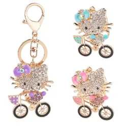 Crystal kitten op een fiets - sleutelhangerSleutelhangers