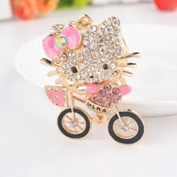 Crystal kitten op een fiets - sleutelhangerSleutelhangers