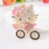Crystal kitten op een fiets - sleutelhangerSleutelhangers