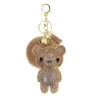 Kristallen teddybeer met pom pom van bont - sleutelhangerSleutelhangers