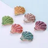 Kristallen schelp - elegante brocheBroches