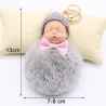 Slapende babypop - sleutelhangerSleutelhangers