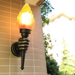 Retro hand with torch - wall lampWandlampen