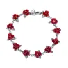Gold & silver bracelet with red rosesArmbanden