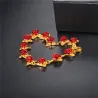 Gold & silver bracelet with red rosesArmbanden