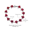 Gold & silver bracelet with red rosesArmbanden