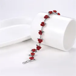 Gold & silver bracelet with red rosesArmbanden