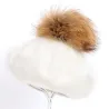 Elegant beret with fur pom-pomPetten & Hoeden