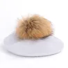 Elegant beret with fur pom-pomPetten & Hoeden