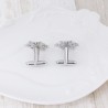 Silver cufflinks with snowflake and Christmas treeManchetknopen